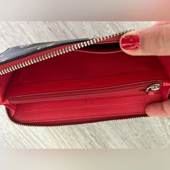 COACH canvas backpack and COACH leather wallet.